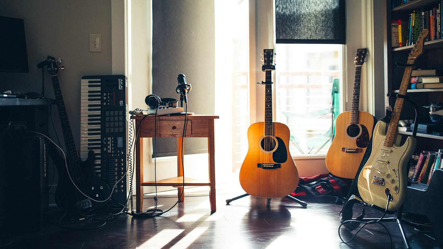Bandzoogle: the release strategy of successful indie artists. Image of a sunny room containing a home recording setup.